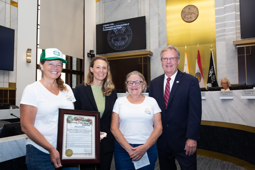 NCG representatives DJ Strong and Pam Heatherington accepting a County proclamation with Supervisor Lawson-Remer and Supervisor Desmond